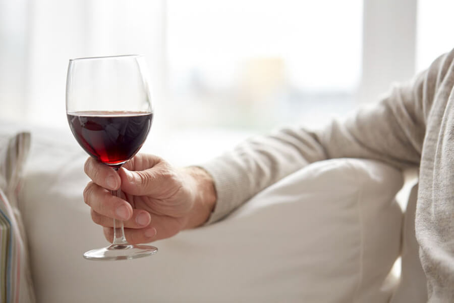 Man holding glass of wine