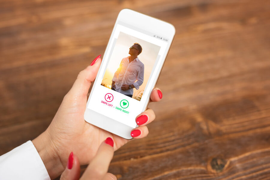 Woman holding phone on dating app