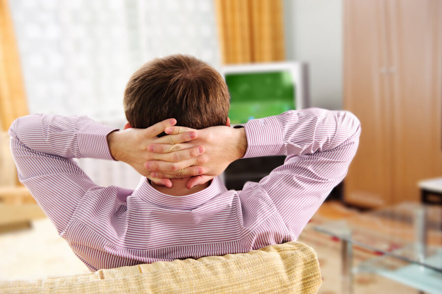 Man watching tv on couch