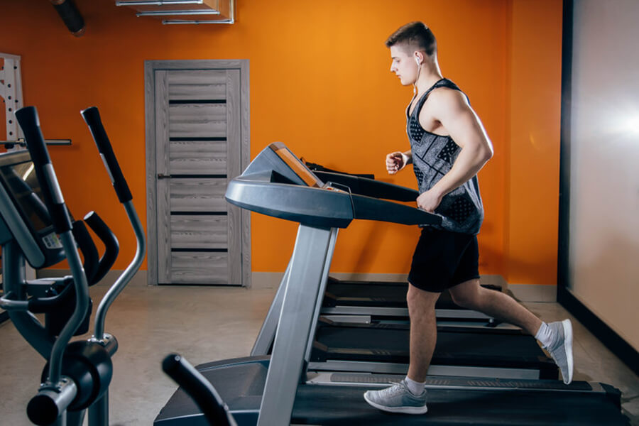 Man on treadmill in gym