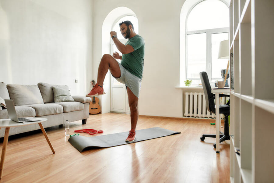 Male exercising in home