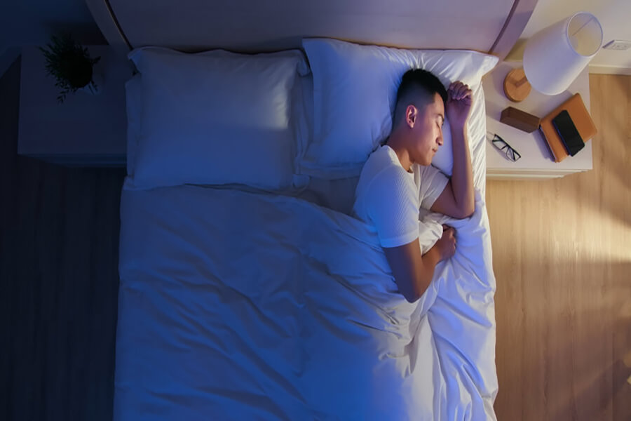 Male sleeping in bedroom