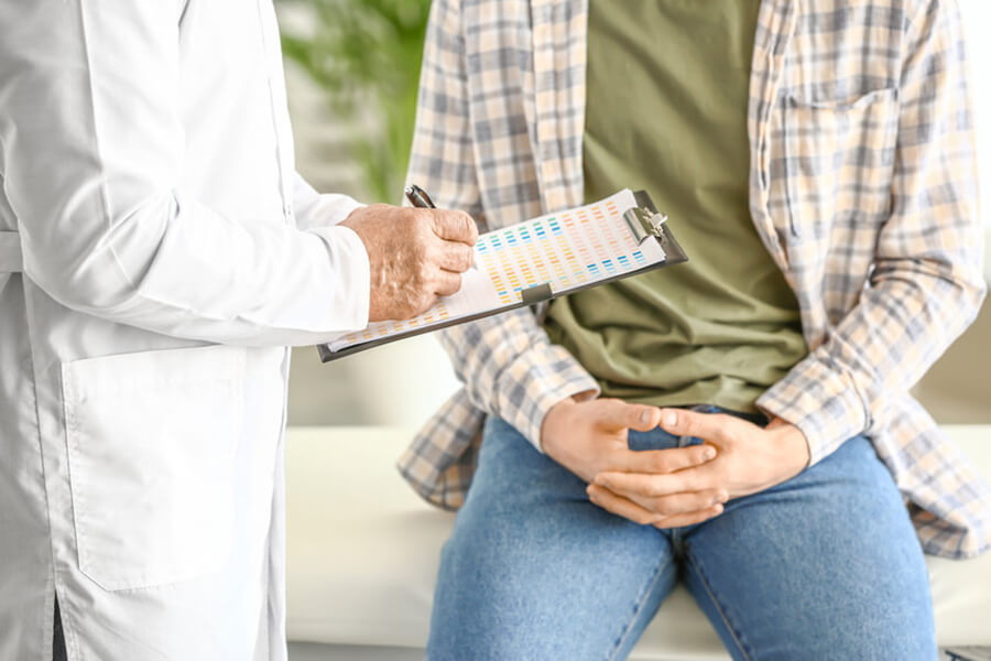 Male patient speaking with doctor